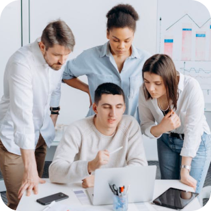 Team collaborating in a white workspace